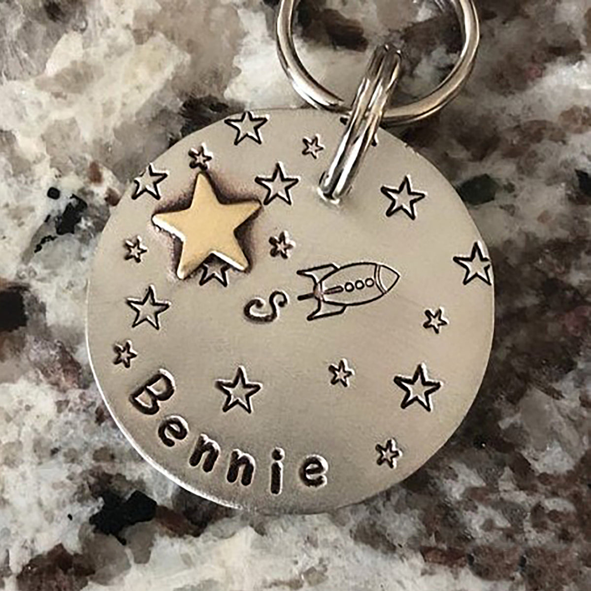 Rocket shaped dog tag top
